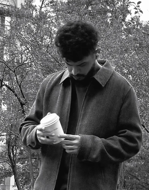 Arpit Sidana holding a coffee cup